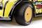 Yellow toy car with black text 'RACE RIVAL' and detailed black designs on the bodywork and tyres.
