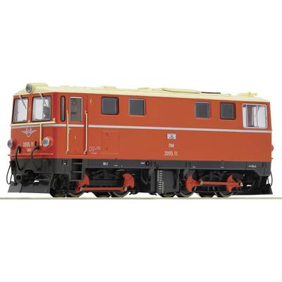 A red and yellow locomotive photographed from the side. It has black wheels and windows. Manufacturer details and identification numbers are visible.