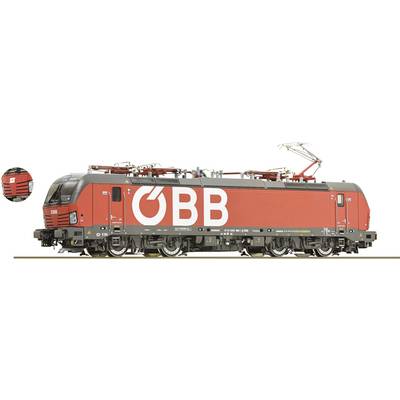 Red ÖBB train with large white letters 'ÖBB' on the side, standing on a railway track. Locomotive with overhead pantograph visible.