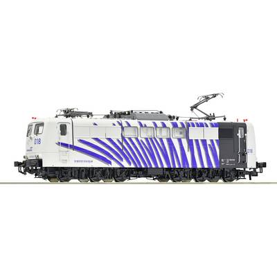 A white electric locomotive with blue stripes and the number '018' on the side. The roof shows technical details and current collectors.