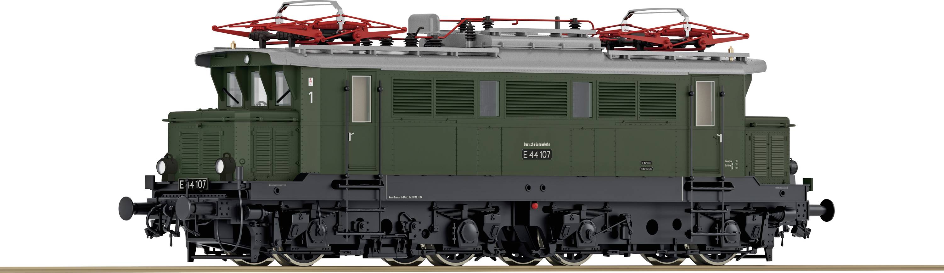 A green model locomotive of the Class E 44 with detailed superstructures and pantographs, pictured side-on on railway tracks.