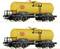 Two yellow tanker wagons with 'Minol' written on their sides, featuring black details, are standing on railway tracks.