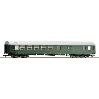 Green railway passenger carriage with multiple large windows, silver roof, and black wheels, standing on a track.