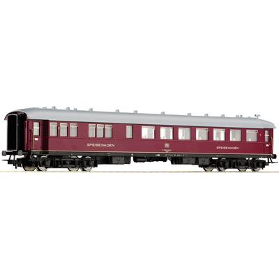 Red dining car in a retro style on railway tracks, side view. The carriage has many windows and is intricately designed.