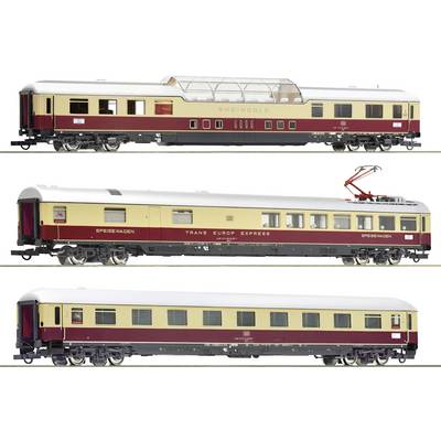 Three model railway carriages: At the top, a panoramic carriage 'Rheingold', in the middle, a dining car 'Trans Europ Express', below a standard passenger carriage.