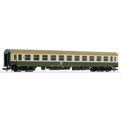 Green and yellow railway carriage of Deutsche Bahn, DB model number 2, parked on railway tracks.