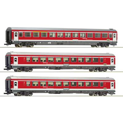 Three red regional train passenger carriages displayed in a row on a track. Different models with Deutsche Bahn logo and window configurations.