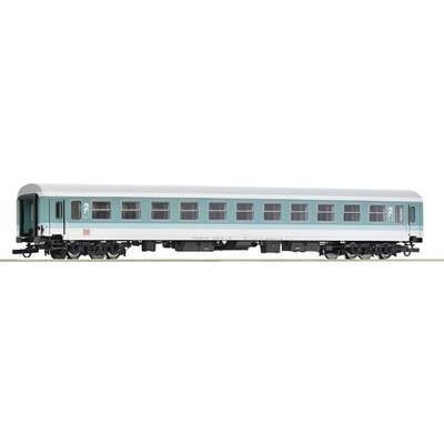A model train passenger carriage in turquoise and white with the number '2' at the ends shows detailed windows and wheels.