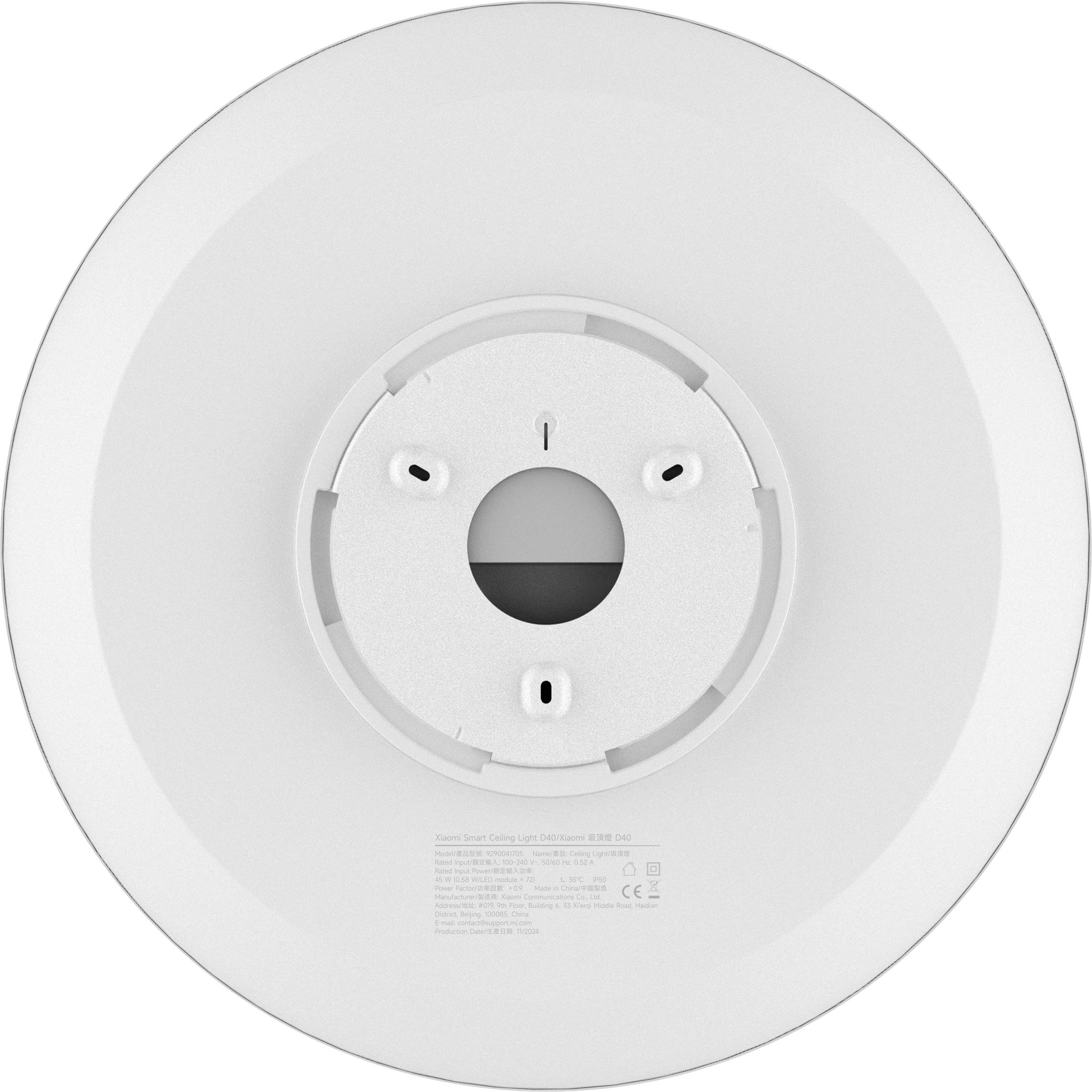 Round, white ceiling light with central mounting, suitable for uniform room illumination; technical information printed on surface.