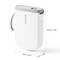 Portable label printer in white with a grey top and carry loop. Dimensions: 10.9 cm high, 7.8 cm wide, 3 cm deep.
