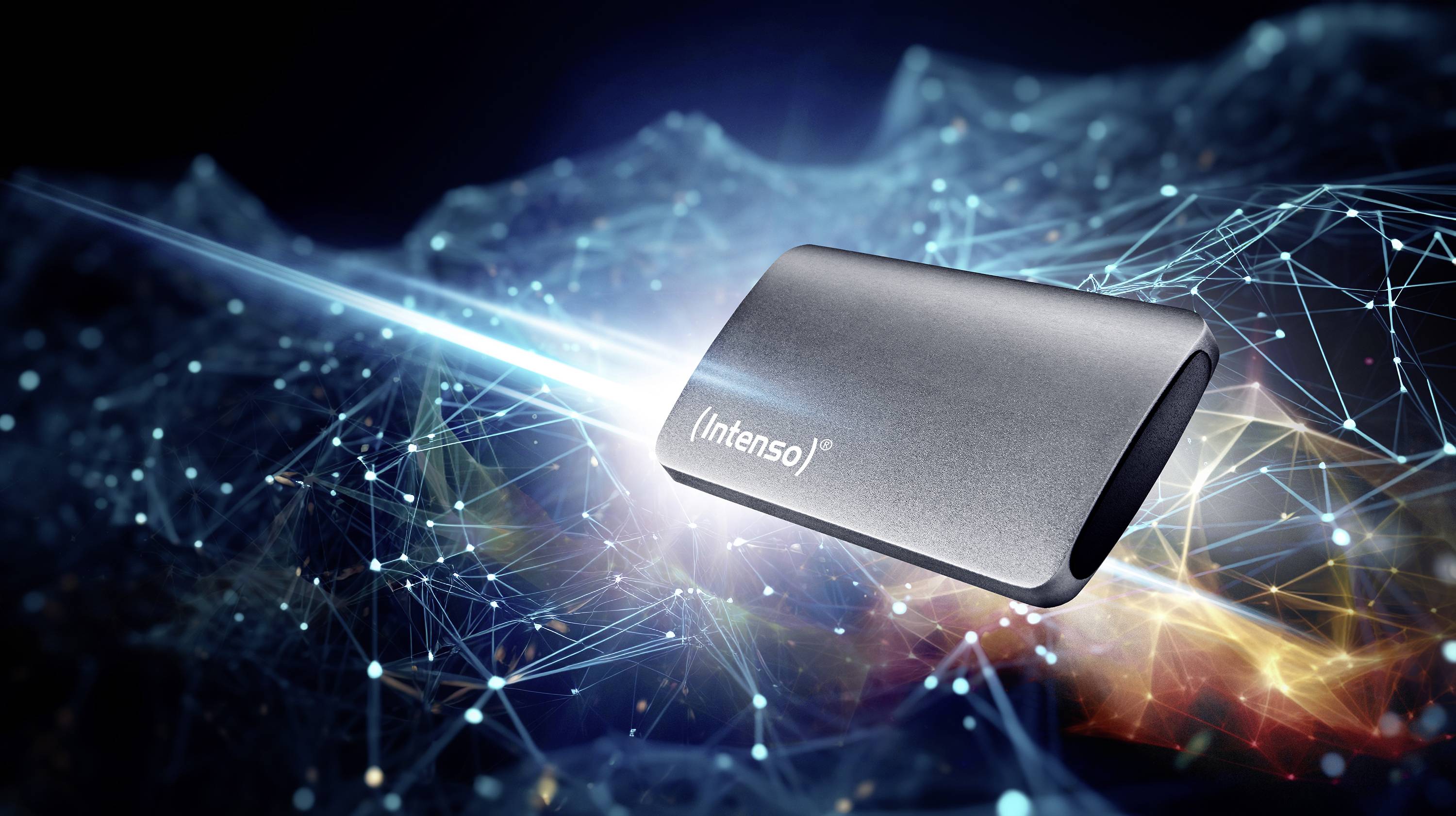 An external Intenso hard drive hovers in front of a digital background with blue and orange light patterns, symbolising connectivity.