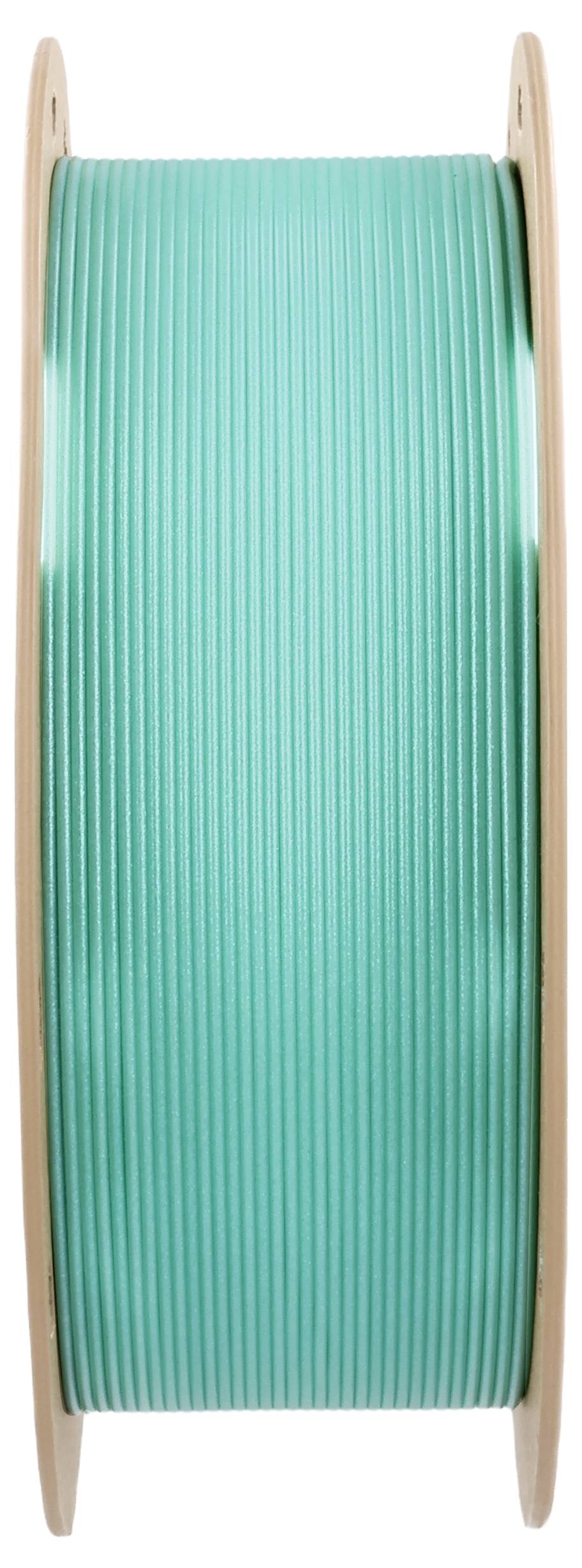 A spool of green 3D printer filament, used for manufacturing plastic parts in 3D printers.