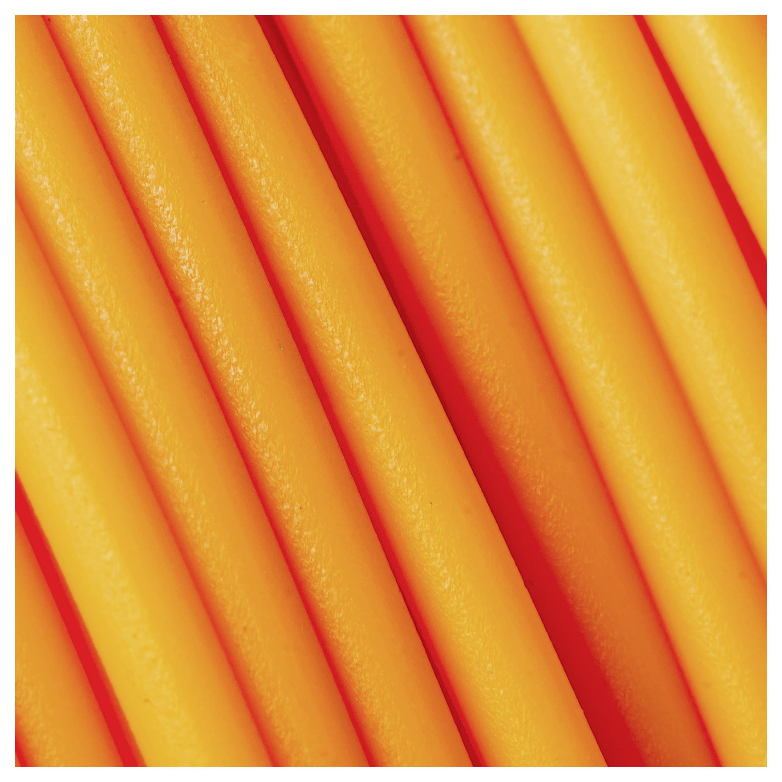 Orange noodles arranged in a tight pattern, close-up.