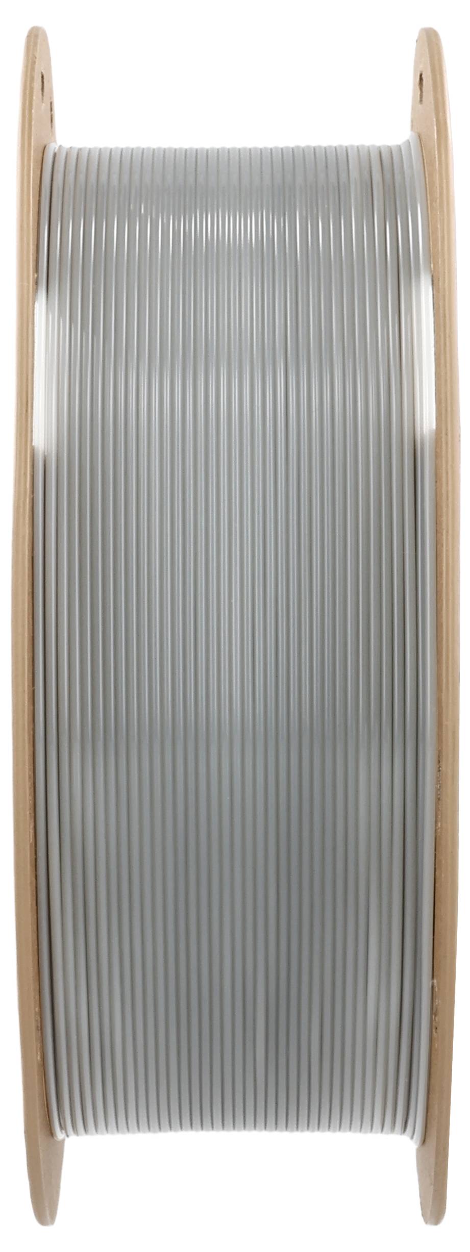 A large roll of silver-colored wire rope that is stretched vertically between two wooden edges.