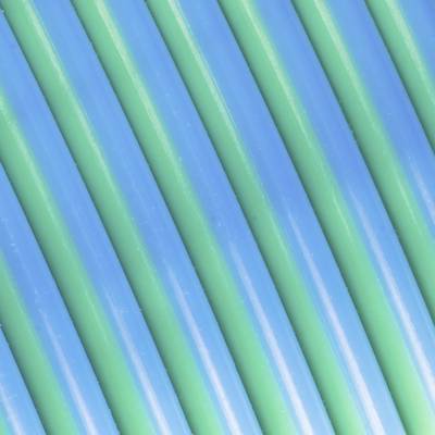 Blue and green parallel lines run diagonally across the image, creating a symmetrical, striped pattern.