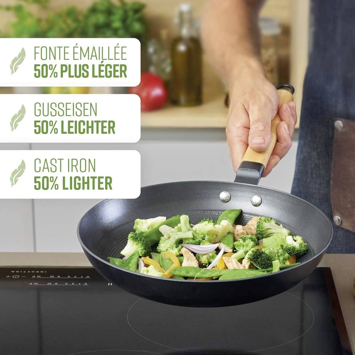 A pan with vegetables on the hob. A label indicates that enamelled cast iron is 50% lighter.