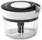 A transparent manual chopper with a black and white lid, perfect for chopping food in the kitchen.