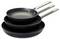 Three black frying pans with stainless steel handles, stacked on top of each other. Different sizes, from small to large.