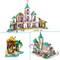A toy castle with colorful towers and decorative elements shows a tropical island with a figure and an animal.