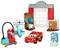 Toy garage made of building blocks with red race car, tools and accessories, inspired by an animated movie.