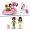 Two toy figures in summer clothing, one holding an ice cream. An inflatable flamingo boat and a small boat with a toy cat.