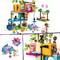 Lego play scene with a colorful treehouse construction, figures, animals and accessories. Children are depicting scenes with animals.