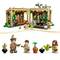 Toy building set with greenhouse and figures. Figures water plants and carry gardening tools. Colorful, detailed design.