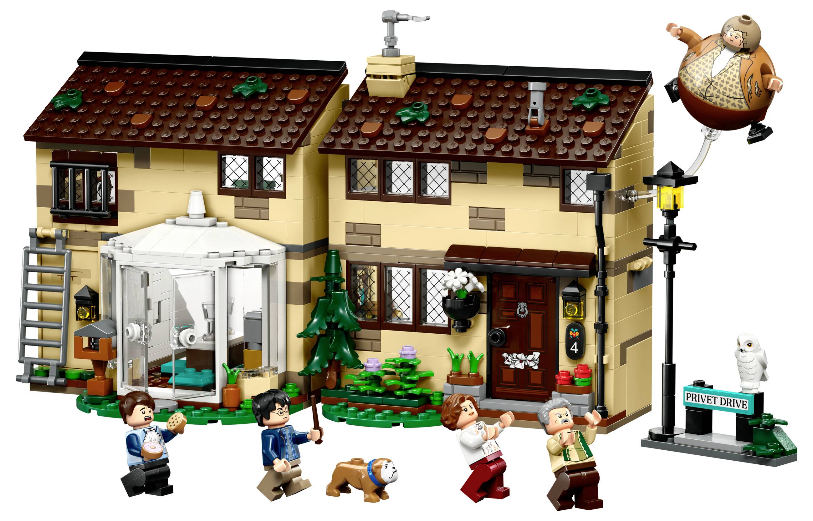 LEGO set shows a two-story house with figures, including a man floating in the air. Surrounded by additional figures and accessories.