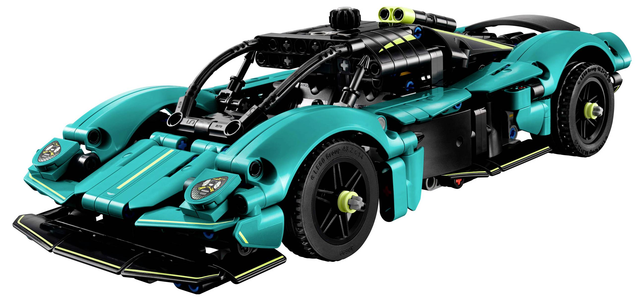 Toy car made of building blocks in turquoise design with black wheels and yellow details, front side view.