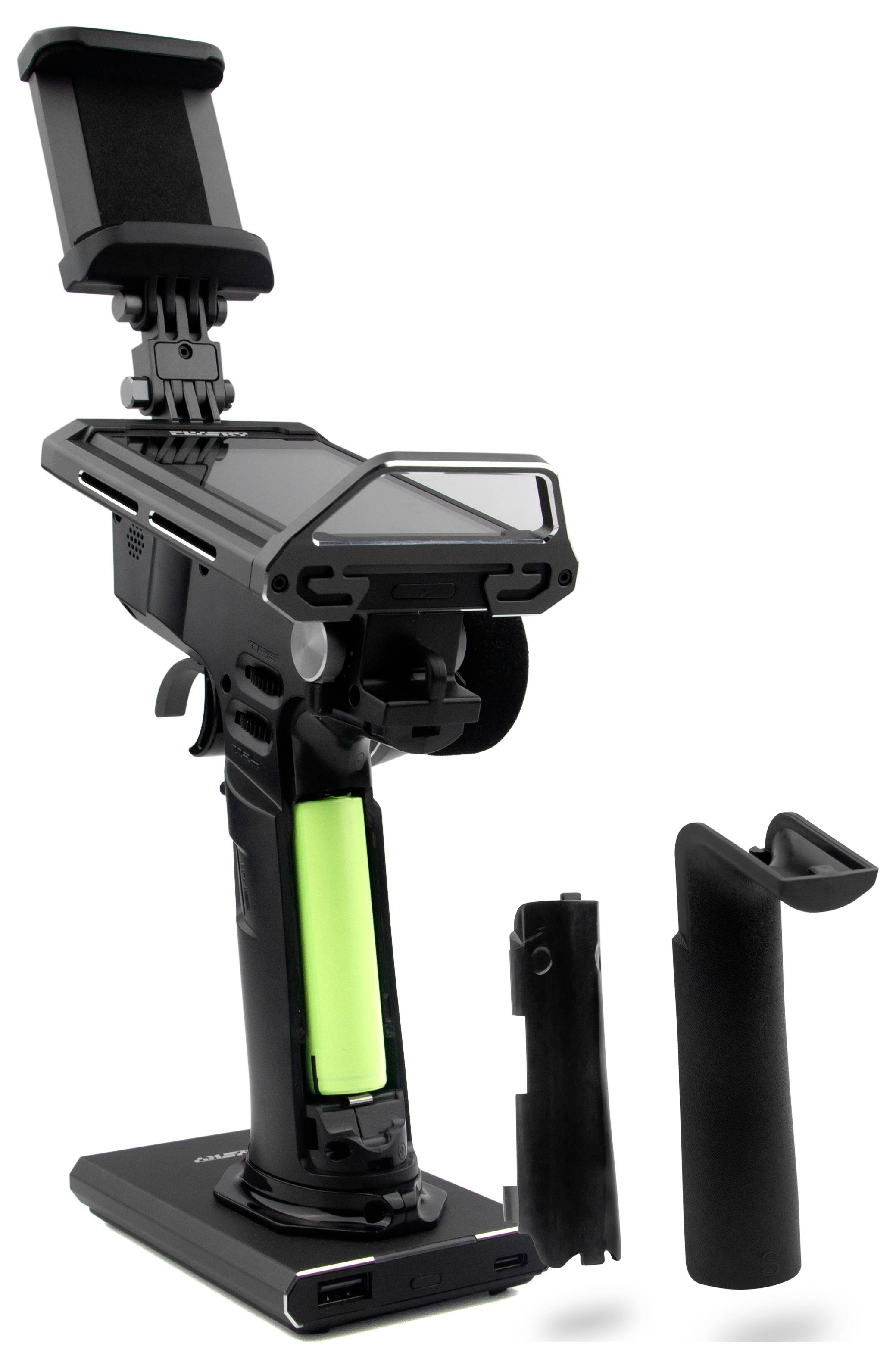 A wireless headphone set with a detachable mount, an open compartment with a green battery, and a charging base.