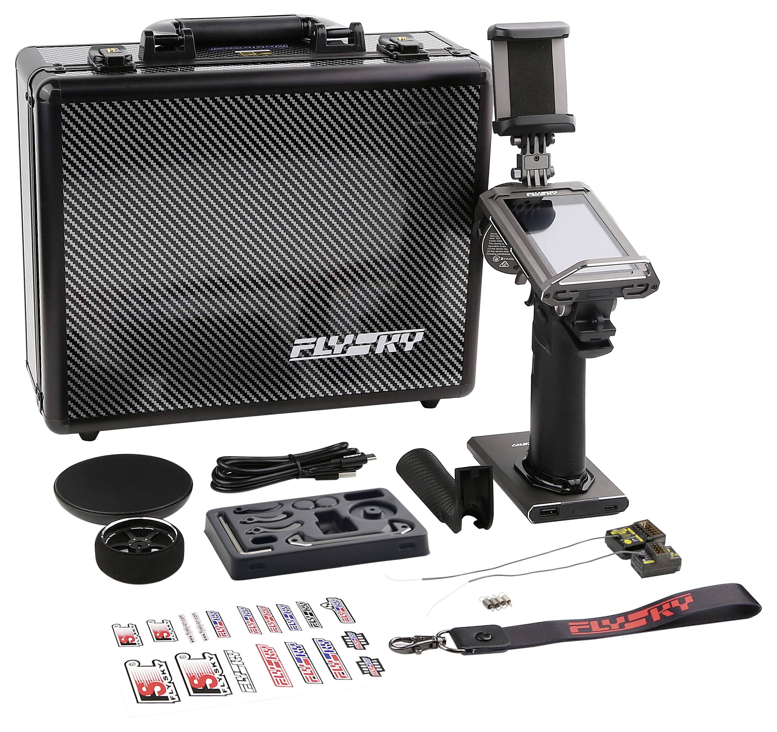 RC Remote Control and Accessories in front of a Transport Case. Includes stickers, carrying strap, charger, receiver, and various small parts.