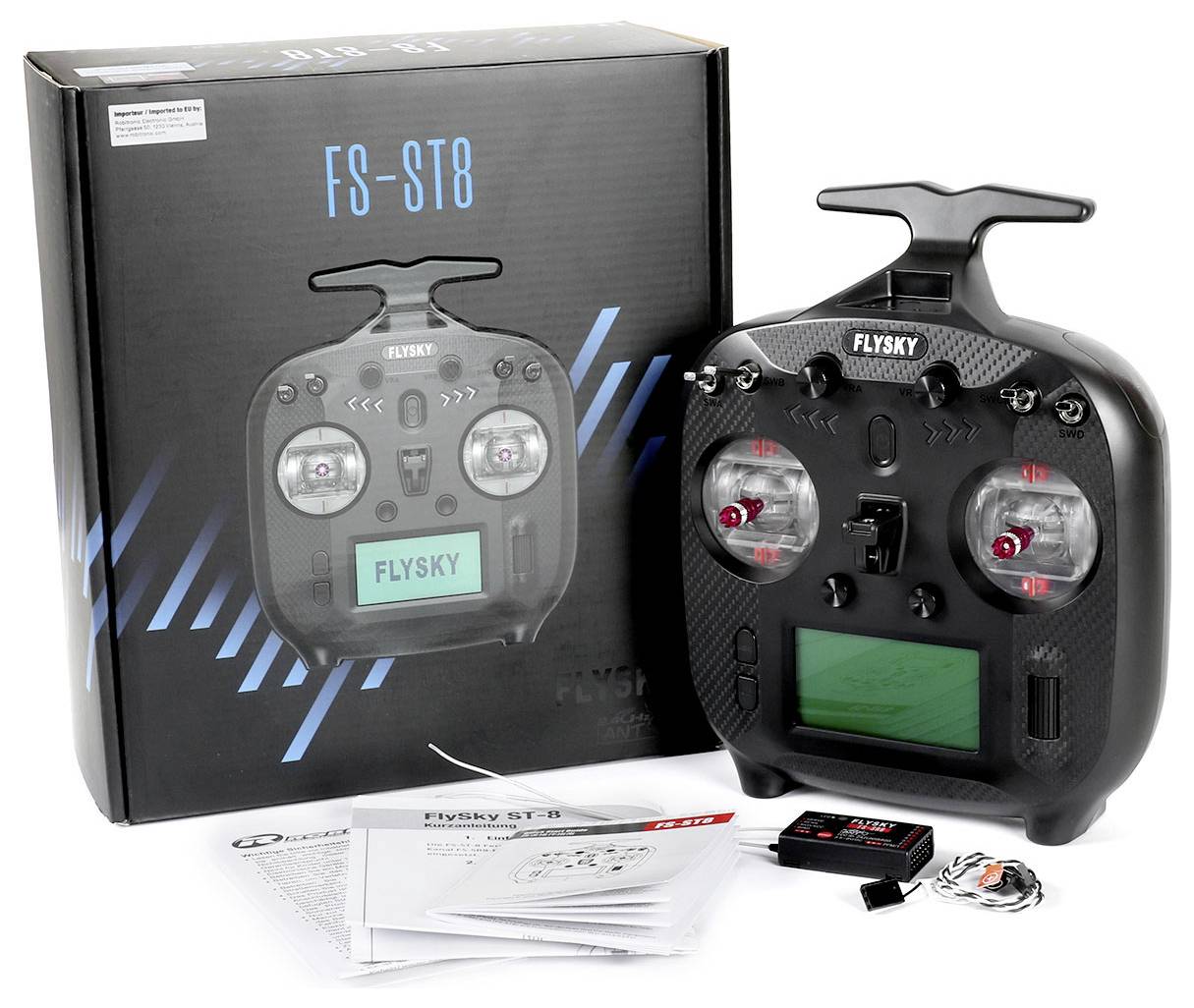 Flight Control FS-ST8 from FlySky with box and accessories including manual, receiver, and cables.