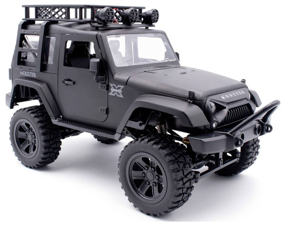 Black remote-controlled off-road vehicle with large tyres and a distinctive bumper, standing on a white background.