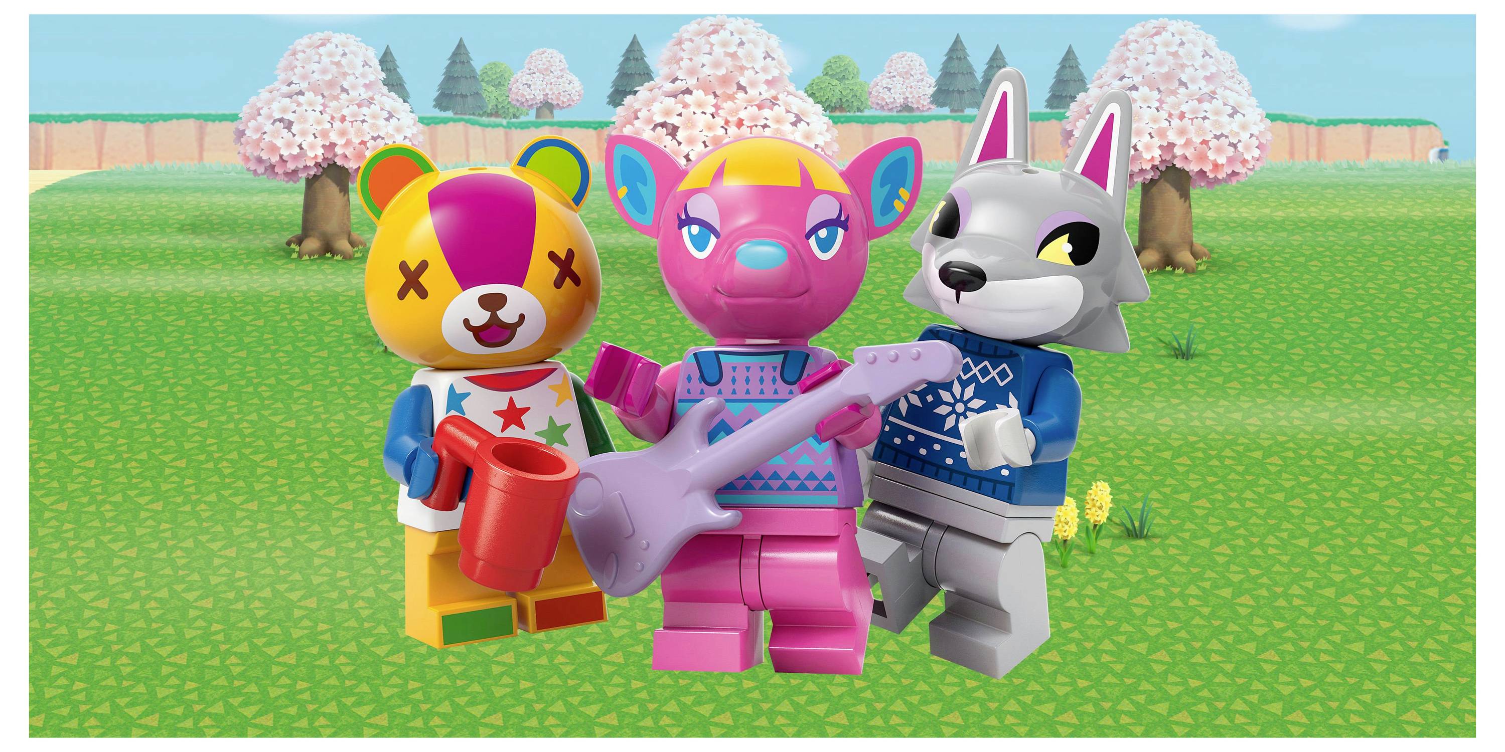 Three colorful toy figures stand in a grassy field with flowering trees. The center figure holds a guitar, and another holds a red watering can.