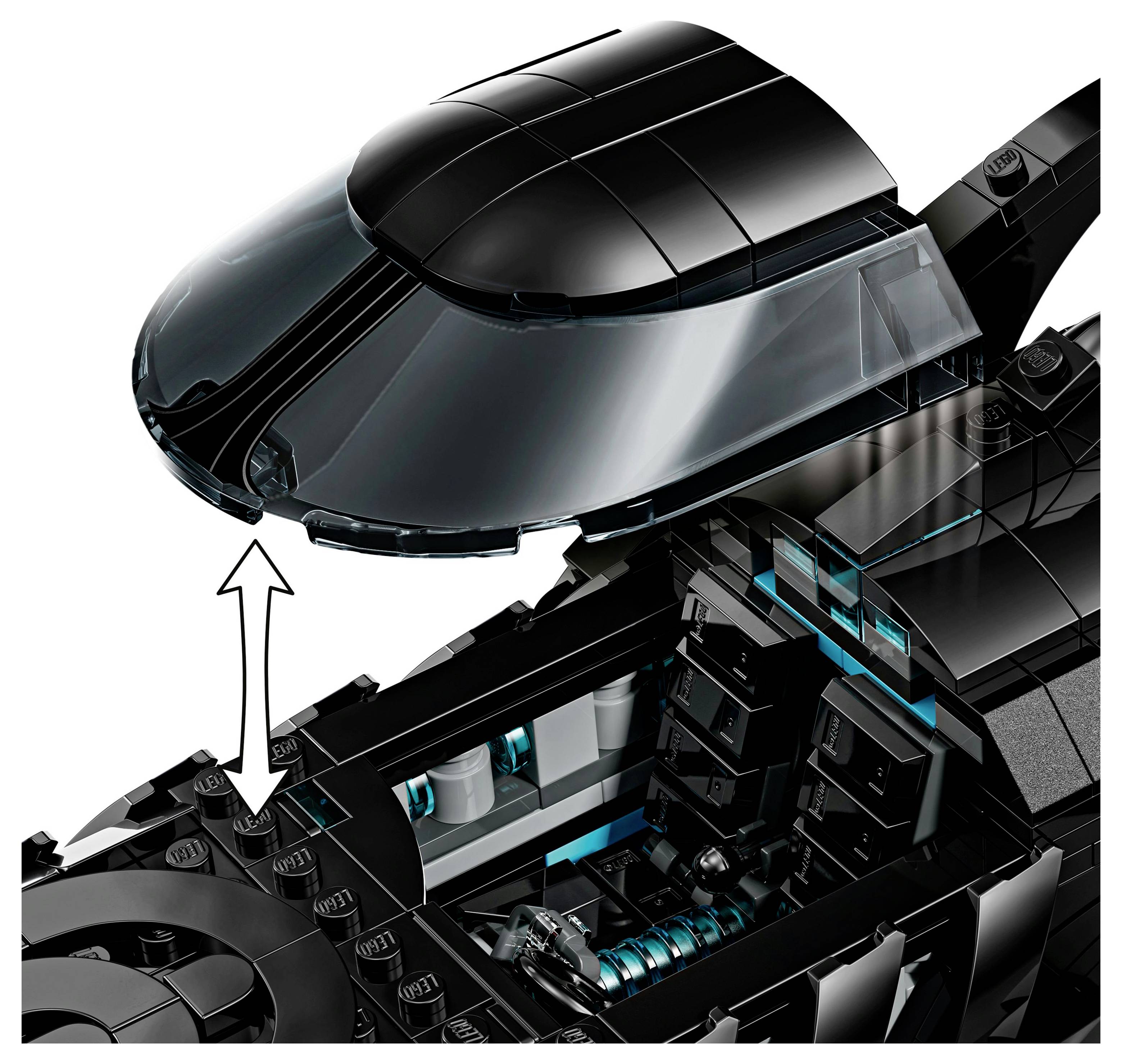 A detailed view of a black LEGO vehicle with an open cockpit, highlighting the inner seat and dashboard, showing a build instruction step.