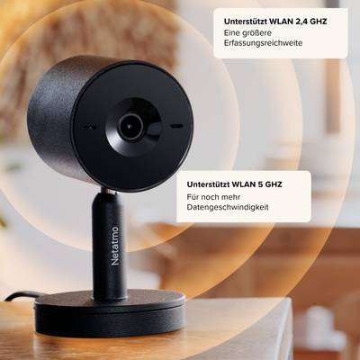 Black camera on table, supports Wi-Fi 2.4 GHz and 5 GHz. Captures wide range; higher data transfer speed.