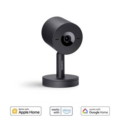 A black Netatmo surveillance camera on a table. Logos indicate compatibility with Apple Home, Alexa, and Google Home.