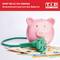 A pink piggy bank with a green power plug attached lies on Euro banknotes. Top left reads 'Save up to 50% on Energy'.