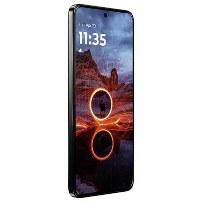 A smartphone with a glowing display shows the date and time; a person stands before a dramatic rock formation, surrounded by swirling lights.