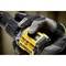 A gloved hand grips a power drill and shows a close-up detail of the battery in a work environment.