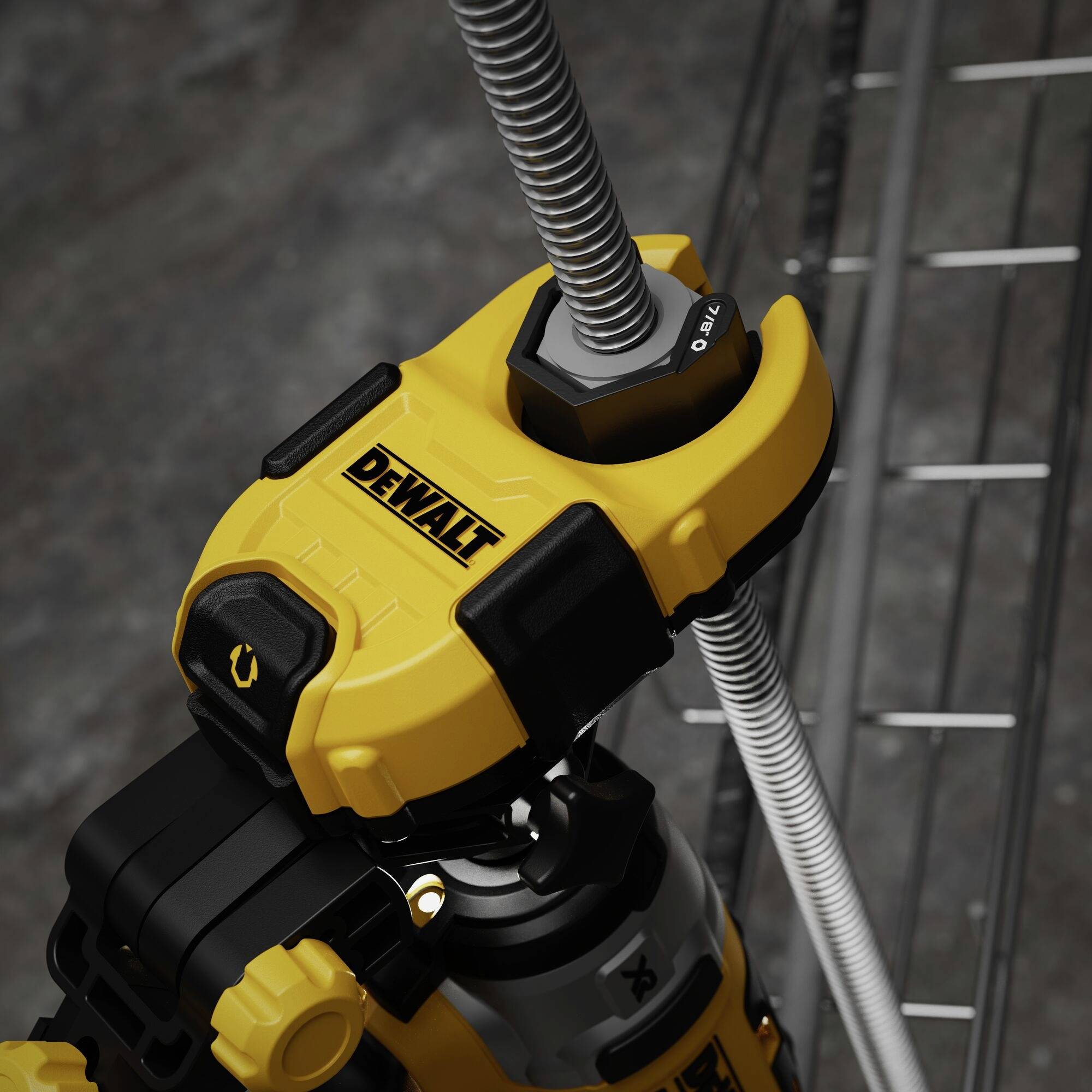 A yellow power tool is gripping a grey metal pipe. The machine bears the 'Dewalt' logo. Metal shelving is visible in the background.