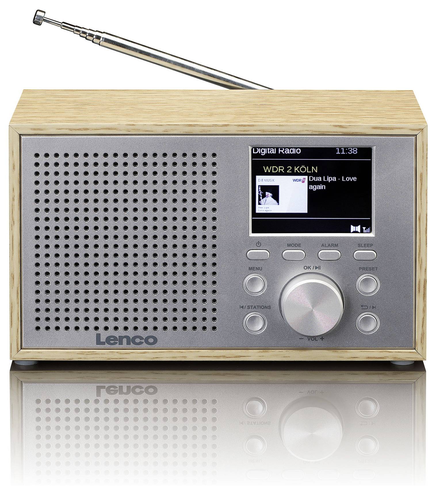 A digital radio made of wood with a metal front. The display shows 'WDR 2 KÖLN - Dua Lipa - Love Again'. It has a rotary dial and buttons.