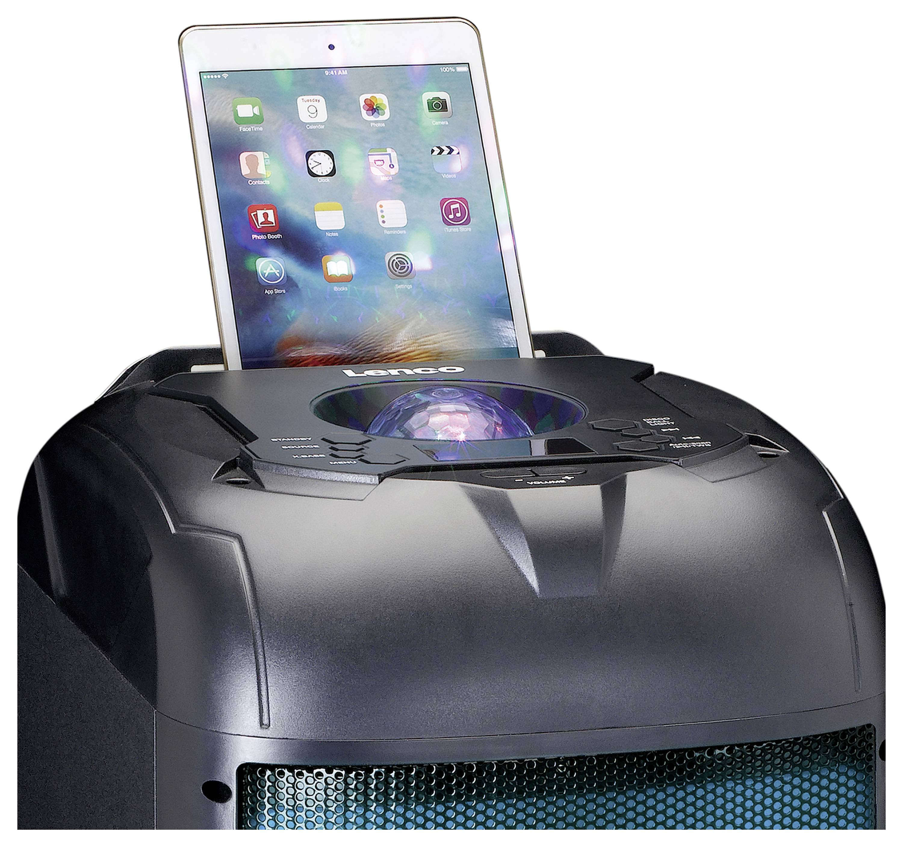 A tablet is docked in a speaker station, providing lighting and music playback. The tablet displays apps on the screen.