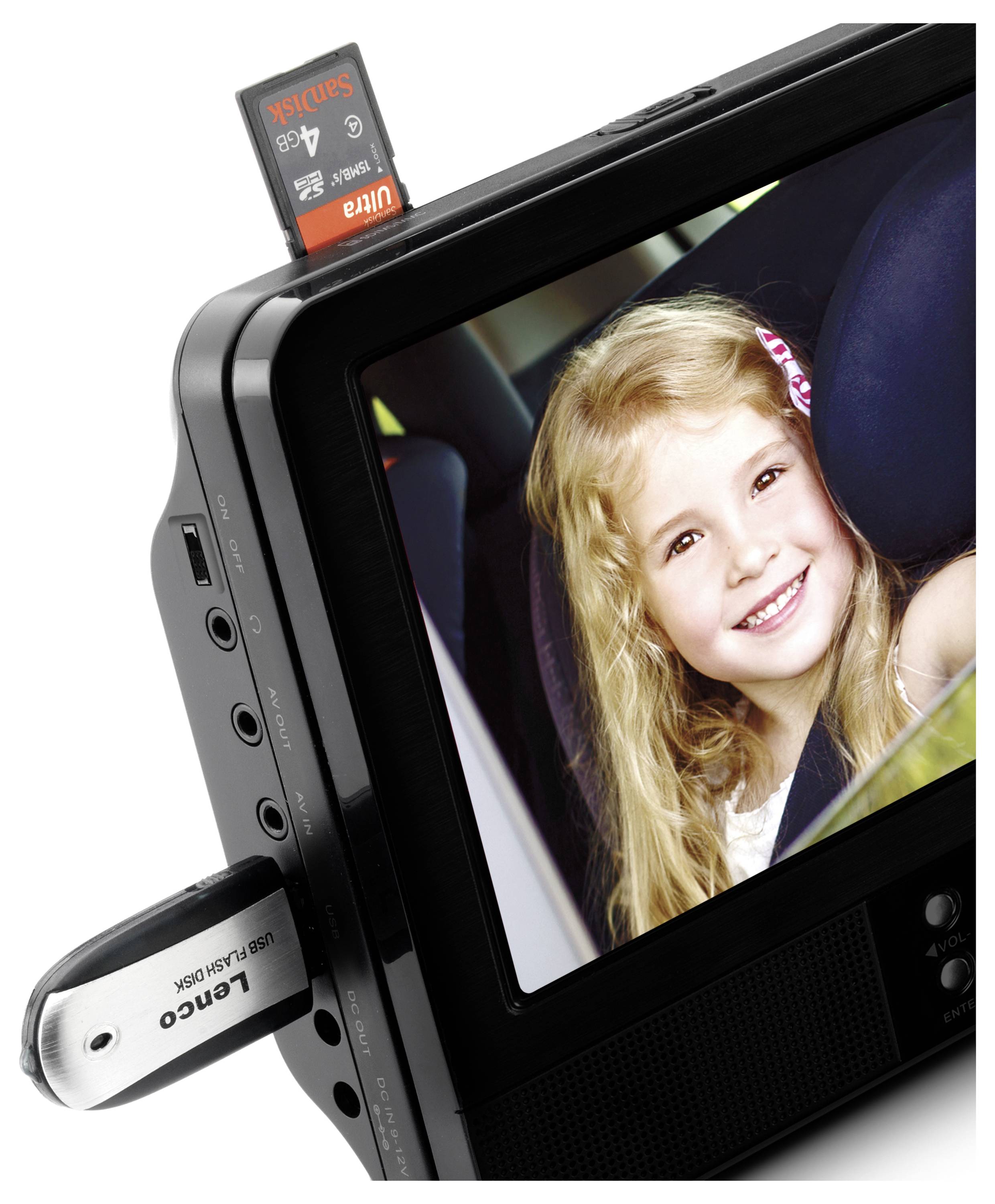 A portable electronic device with a USB stick and an SD card. On the screen, a smiling child can be seen.