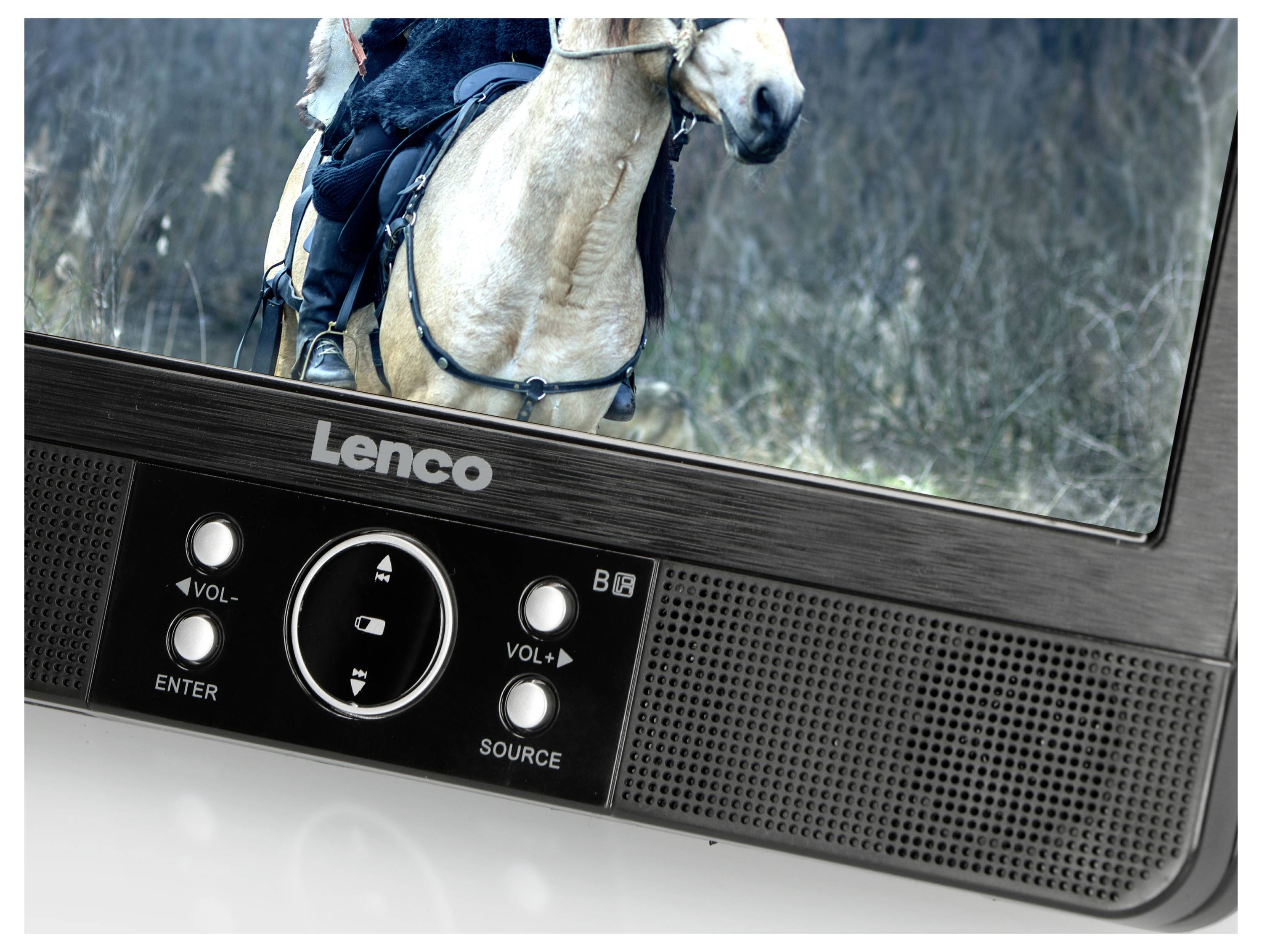 A television displays an image of a rider on a horse in a natural setting. Volume and source buttons are visible in the foreground.