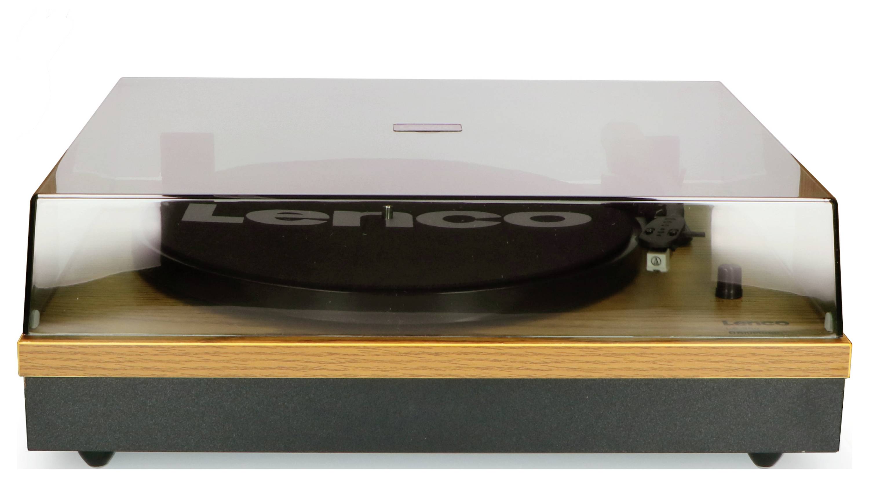 Record player with a wooden-coloured housing and transparent lid. 'Lenco' brand visible on the turntable platter, stylus on the right side.