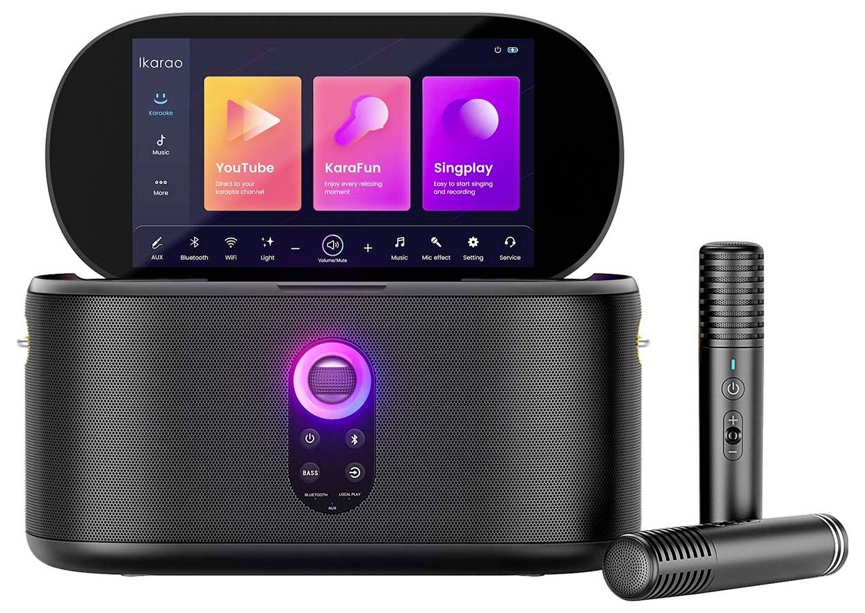 Karaoke machine with touchscreen displaying apps 'YouTube,' 'KaraFun,' 'Singplay.' Includes two microphones and a speaker with LED lights.