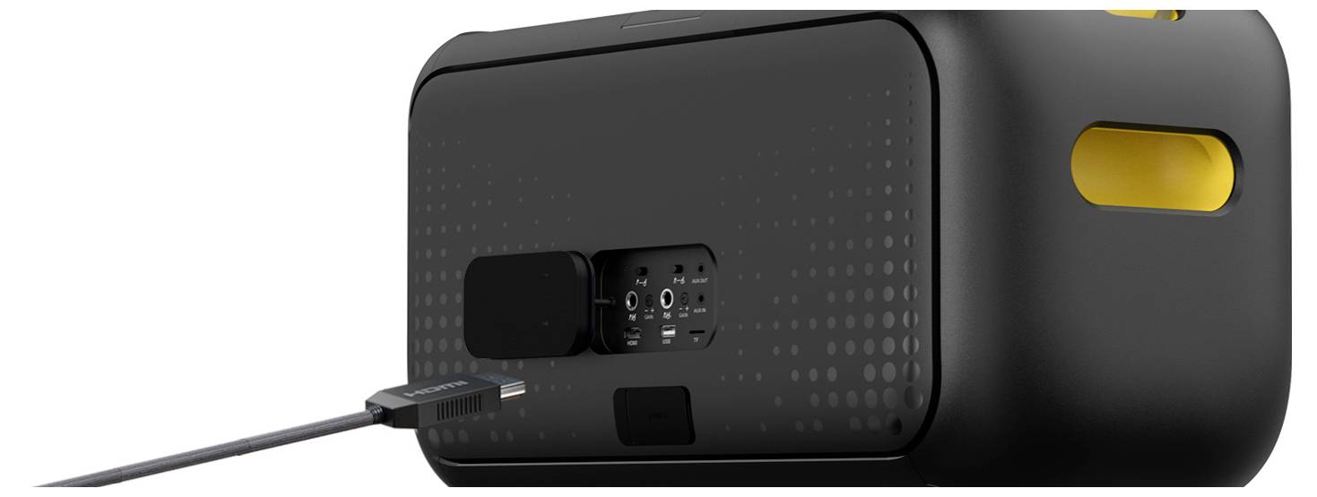 Rear view of a black device with yellow accents, showing ports and a connected cable.