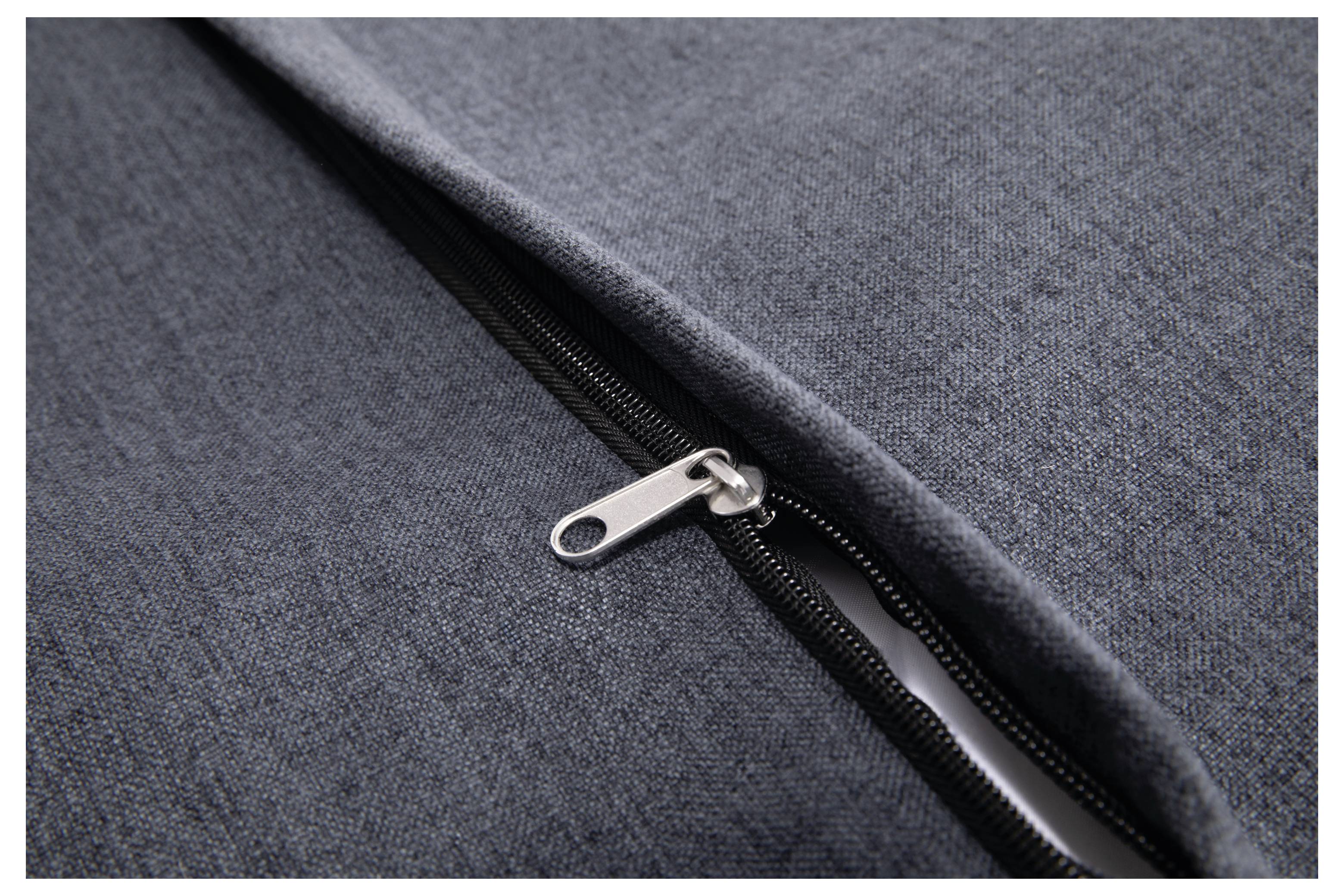 Zip fastener of a grey fabric piece in close-up, showing the structure and material of the clothing.