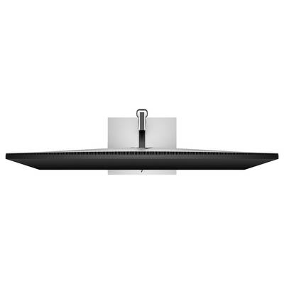 A flat screen viewed from below, mounted on a wall bracket. The mounting mechanism and cables are visible.